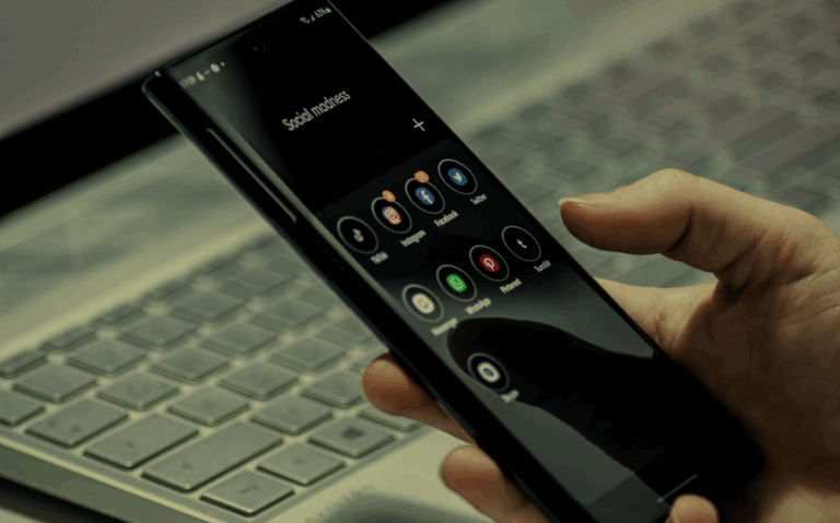 A person's hands holding a smartphone displaying various social media app icons, suggesting the importance of digital connectivity.